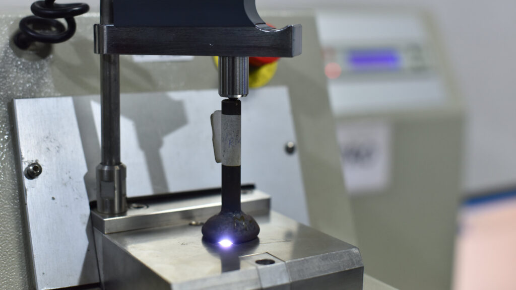 Spectrometer machine analyzing engine valve material chemical composition at AVR Vikram Valves quality assurance lab