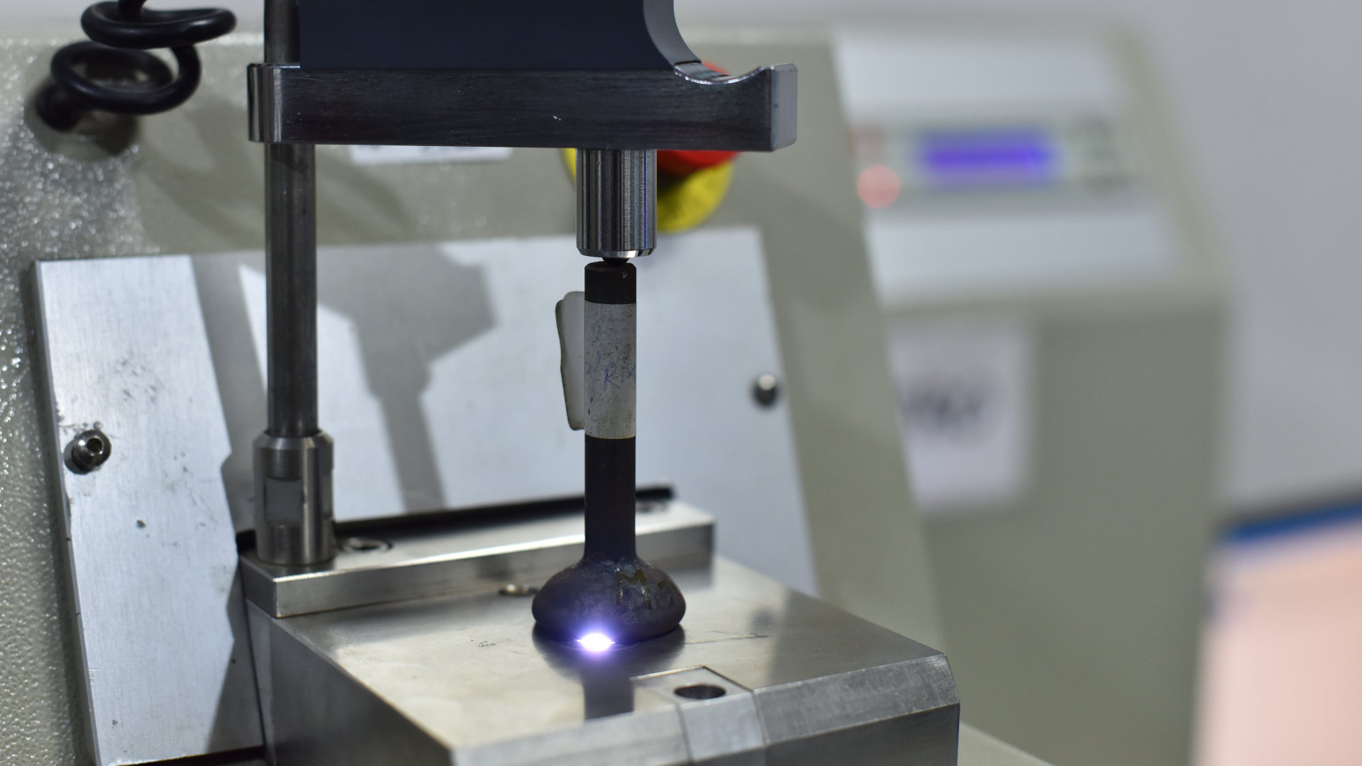 Spectrometer machine analyzing engine valve material chemical composition at AVR Vikram Valves quality assurance lab